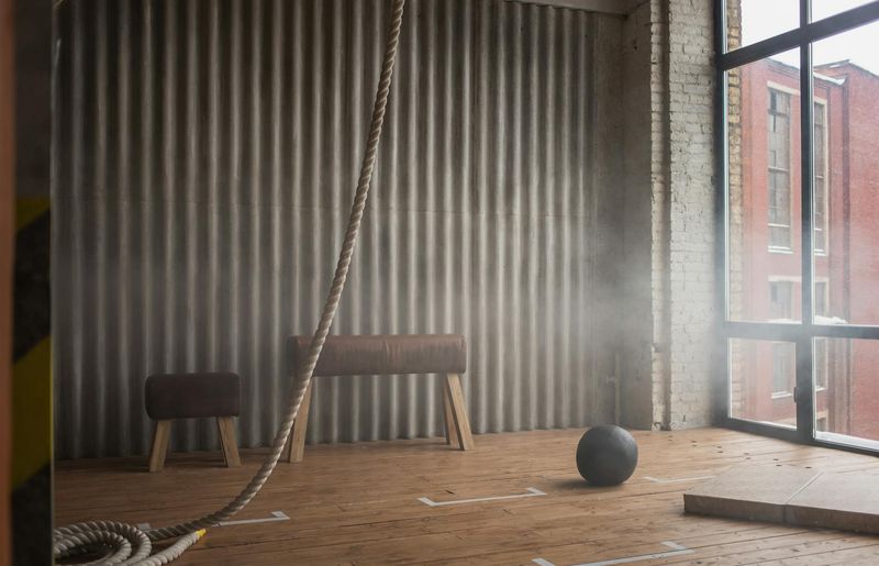 Spacious modern gym with large windows and minimalist design